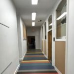 Newly carpeted and renovated school hallway project completed by Mayer Building Company in New Orleans, LA