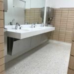 Renovated bathroom for school project done by Mayer Building Company in New Orleans, LA