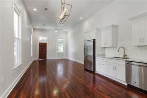 Newly renovated kitchen and living space for residential property by Mayer Building Company in New Orleans, LA
