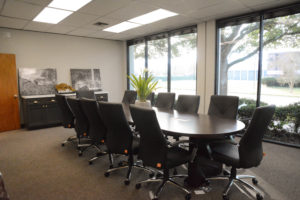 Redesigned office conference room designed and executed by Mayer Building Company in New Orleans, LA